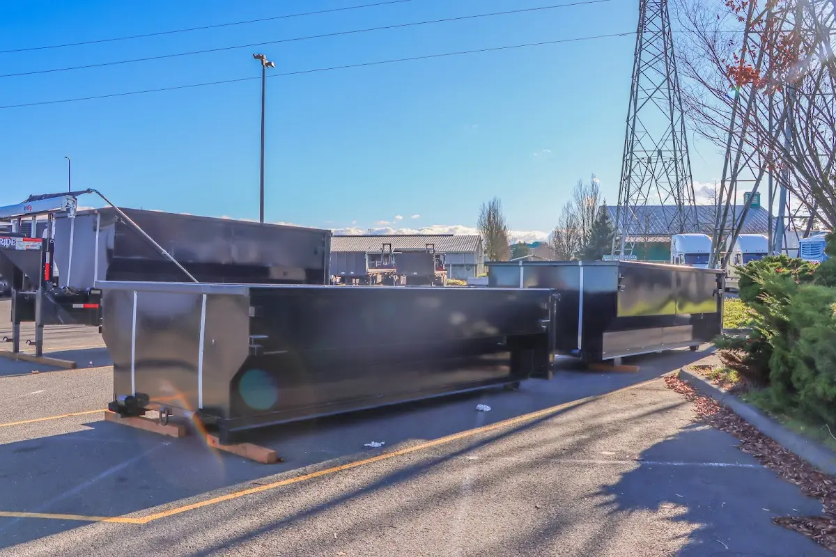 Roll-off dumpster ready for waste disposal at job site for Concrete Dumpster Rental in Westlake